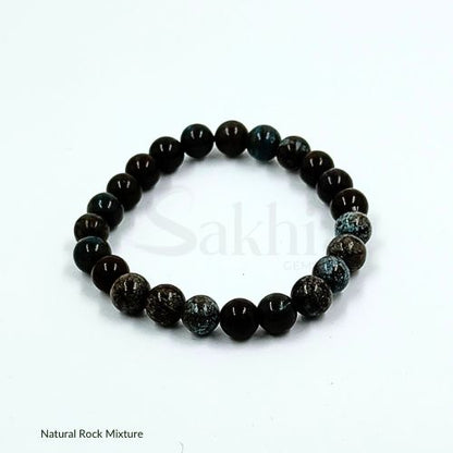 A beaded bracelet made of natural rock mixture, predominantly in dark colors, with variations in patterns and shades.