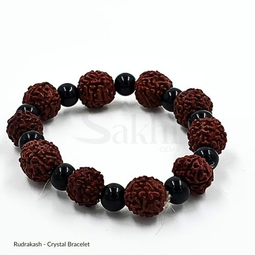 A Rudraksha bracelet with natural beads and black accents, displayed against a white background.